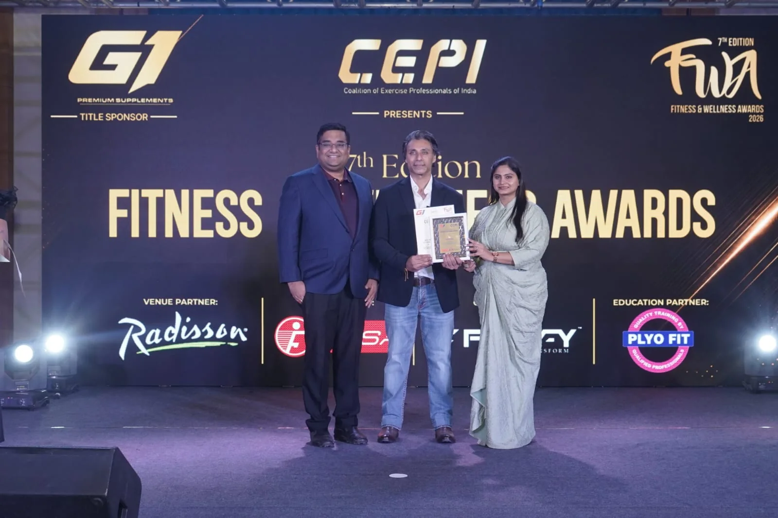 An awardee receiving recognition on the CEPI 2026 awards stage